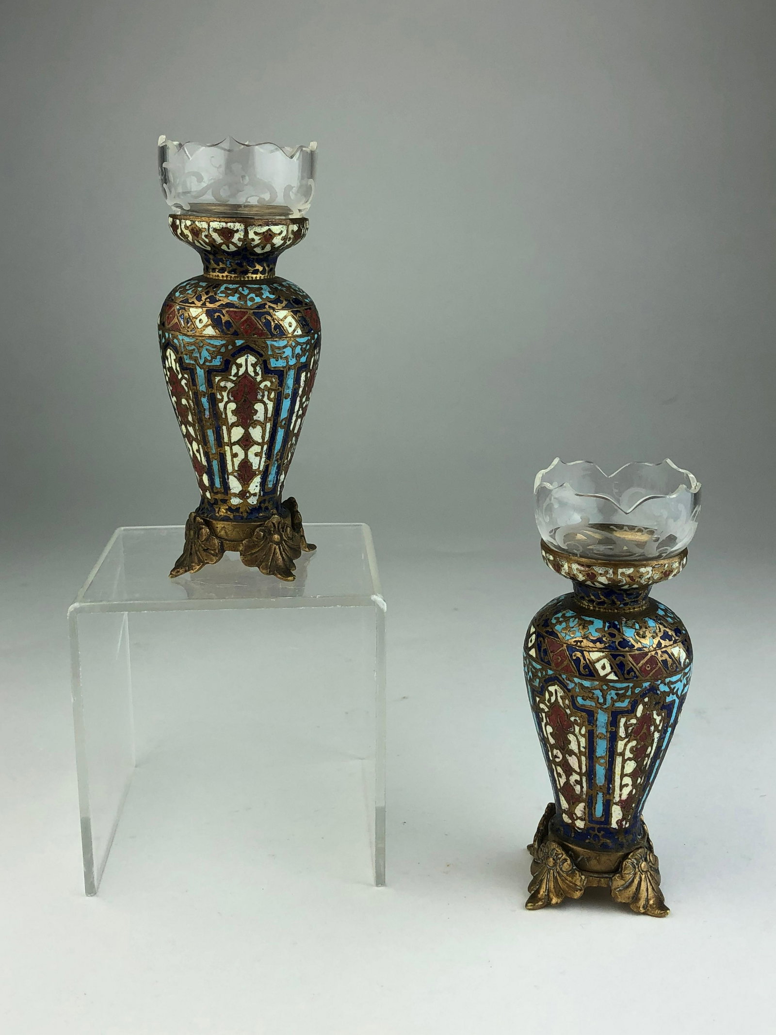 Antique French champleve and glass urns.: Antique French champleve and glass urnseach supported on four scrolled foliate feet.Height 4 1/4 inches.