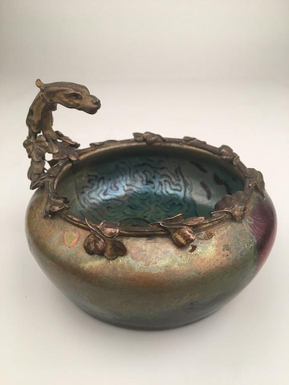 Clement Massier iridescent bowl with Dragon handle: Clement Massier bowl with Dragon handle and rim .Diameter 4 1/2 inches. Height 3 1/2 inches.(Some damage to bottom).