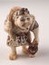 Carved Japanese Netsuke man with a fish on his back.