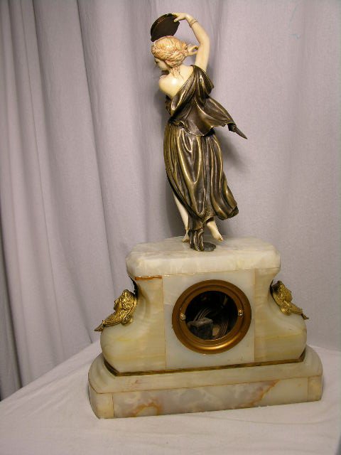 BRONZE AND CARVED MANTEL CLOCK. - 7