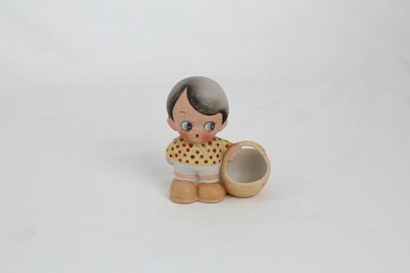 SHAFER AND VATER FIGURINE.: SHAFER AND VATER (GERMAN) FIGURINE OF A LITTLE BOY WITH A BASKET IN HISLEFT HAND. HEIGHT 3 1/4". CIRCA 1920.