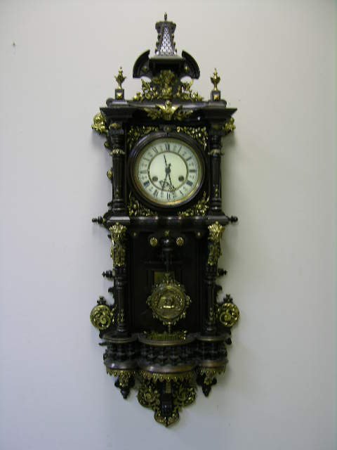 ANTIQUE WALL CLOCK WITH PENDULUM. OVERALL LENGTH