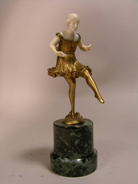 ROLFRITSCH: GILT BRONZE CARVED FIGURINE.