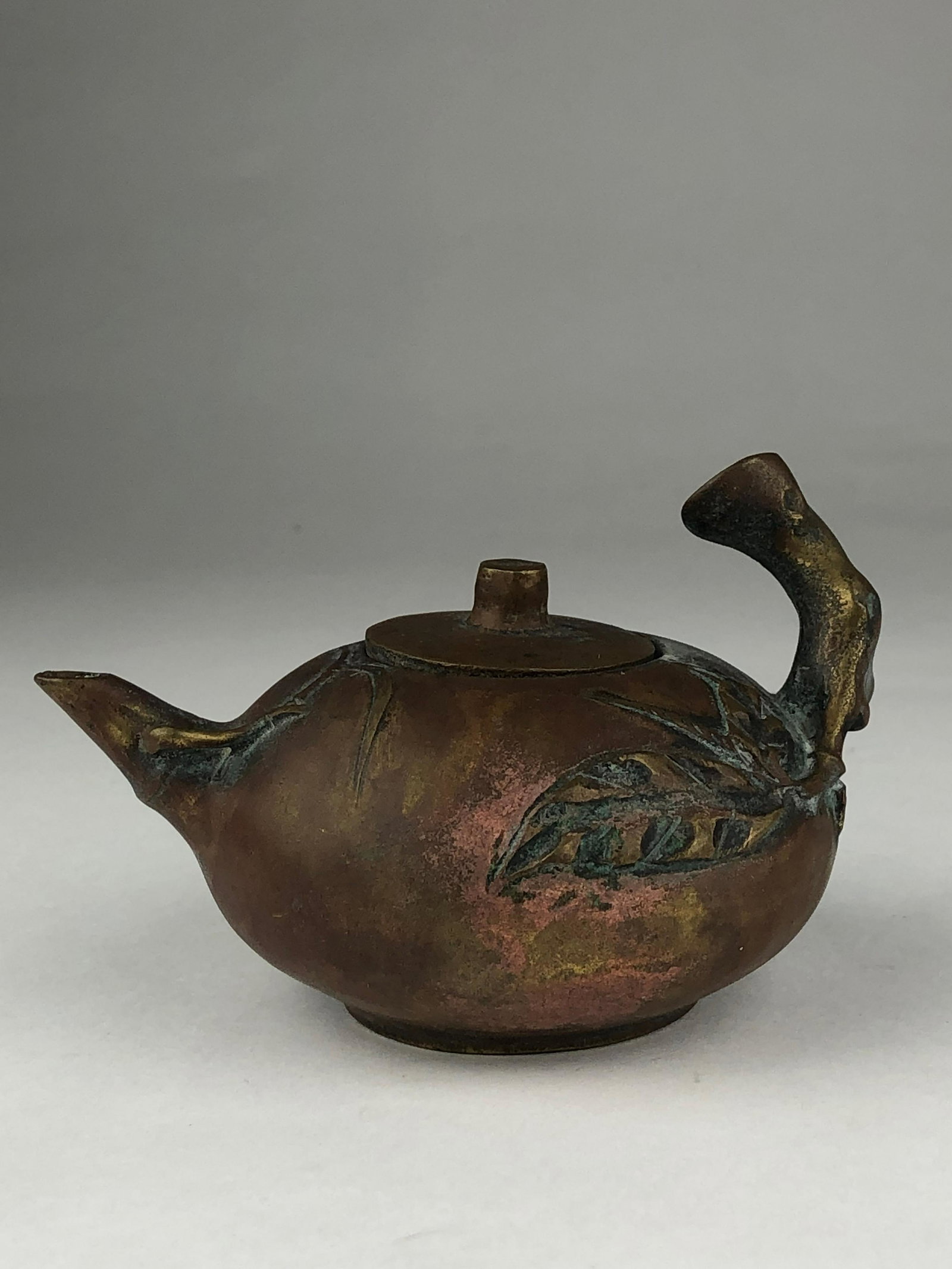 Miniature Japanese bronze teapot. Signed to the side.: Miniature Japanese bronze teapot. Signed on the bottom. Height 2 3/4 inches.