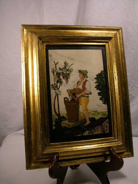 PIETRA DURA PLAQUE OF A MAN POURING A BATCH OF GR