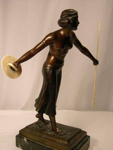 BRONZE CARVED FIGURE OF A FEMALE WARRIOR. - 4