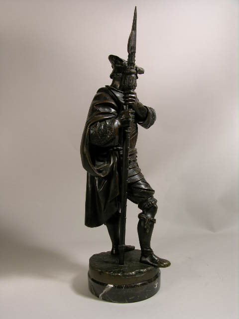 A. CARRIER BRONZE FIGURE OF A MAN WITH WEAPON. - 5