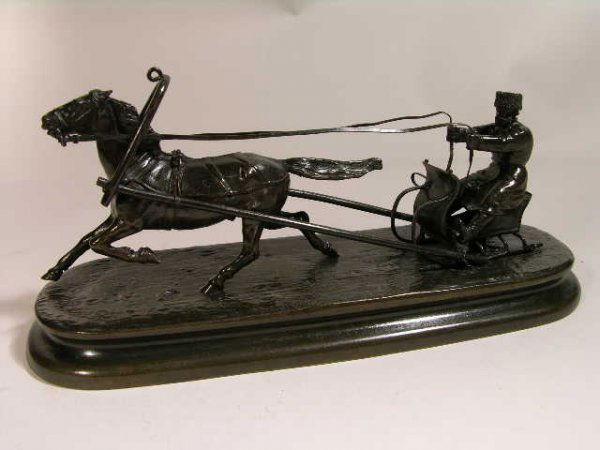 VASILY YAKOVLEVICH GRACHEV BRONZE.: VASILY YAKOVLEVICH GRACHEV (RUSSIAN 1831-1905). A SINGLE SLED RIDDER BEING PULLED BY A HORSE.SIGNED IN CYRILLIC WITH THE WOERFFEL FOUNDRY MARK, ST. PETERSBURG.OVERALL LENGTH 9 1/2" OVERALL HEIGHT 4 1/
