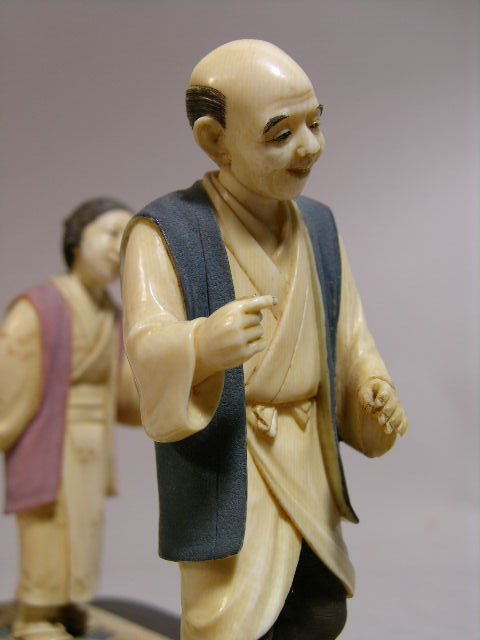 IVORY CARVING OF A MAN AND WOMEN IN A RICE PATTY. - 3