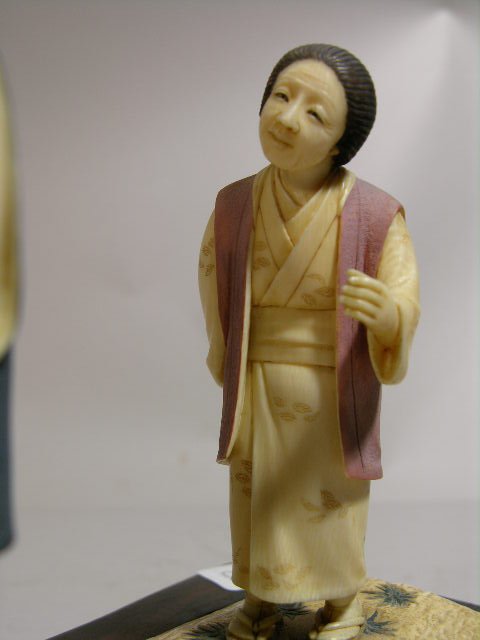 IVORY CARVING OF A MAN AND WOMEN IN A RICE PATTY. - 4