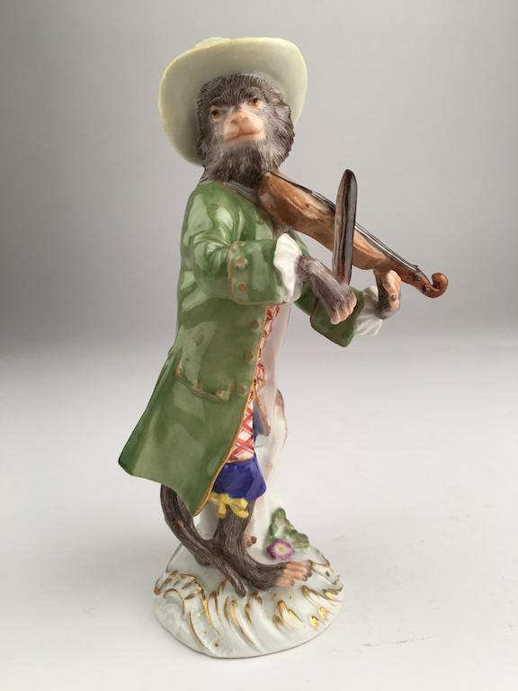 Meissen monkey band member playing a violin.: Meissen monkey band member playing a violin. Properly marked with Meissen crossed swords. Height 51/4 inches.