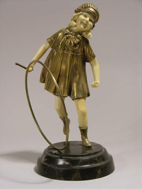CHIPARUS FIGURE OF A YOUNG GIRL WITH HOOP.
