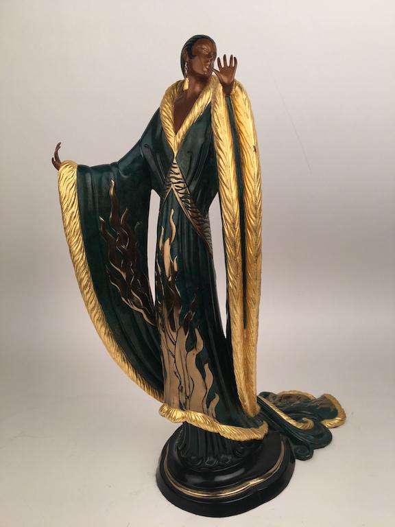 Erte (Romain de Tirtoff, French, 1892-1990). "Femme De: Erte (Romain de Tirtoff, French, 1892-1990).A cold painted bronze figurine titled "Femme De Lux".A figure of a very well dressed lady wearing an elegant dress looking to the left.Signed in the base "3