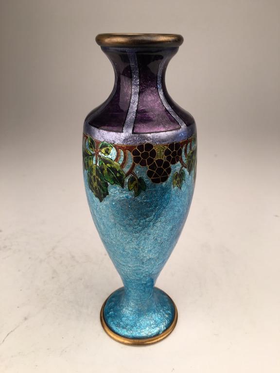 French enamel on copper vase with an inverted rim: French enamel on copper vase with an inverted rim and round footed base decorated with a band of flowers towards the top, Signed "Faure-Marty Limoges". Height 6 3/4".