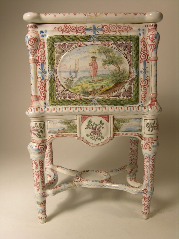 DELF BOX PAINTED WITH ROMANTIC SCEENS.: DELF BOX PAINTED WITH ROMANTIC SCEENS. VERY FINE WORKMANSHIP WITH GREAT DETAIL. COVERED BOX WITH LID AND SUPPORTED WITH FOUR LEGS. OVERALL HEIGHT 8 1/4". CIRCA 1880.