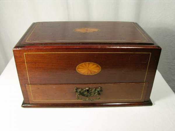EDWARDIAN STORAGE BOX WITH TWO BRASS HANDLES.: EDWARDIAN STORAGE BOX WITH TWO BRASS HANDLES. AS YOU SLID TOP COVER BACK IT OPENS THE DRAWER BENEATH. THE BOTTOM DRAWER HAS A SMALL ROUND METAL HOLDER WHOSE WOOD FRAME IS CRACKED BUT FUNCTIONS WELL. T