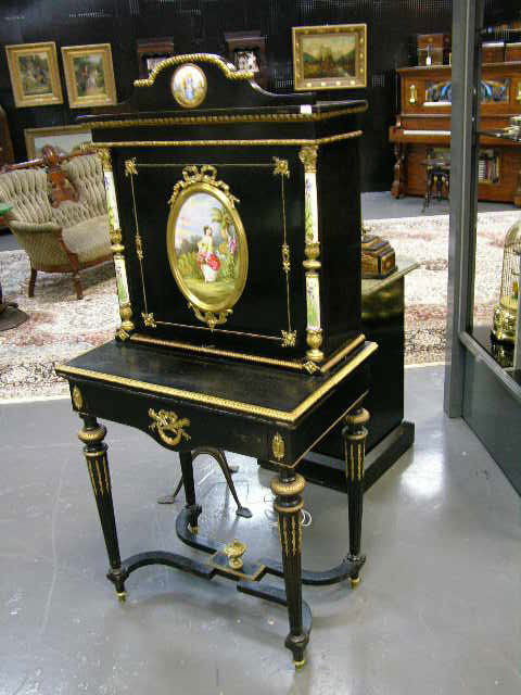 EBONY CABINET WITH ONE FRIEZE DRAWER WITH GILT MOU: EBONY CABINET WITH ONE FRIEZE DRAWER WITH GILT MOUNTS AND TWO PORCELAIN PLAQUES. FRENCH. CIRCA 1880.