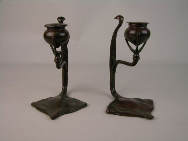 TIFFANY STUDIOS PAIR OF CANDLESTICKS.: A VERY FINE PAIR OF TIFFANY STUDIOS CANDLESTICKS, EACH WITH A VERY STYLIZED GEOMETRIC SHAPED FOOT. EACH FOOT PROPERLY STAMPED "TIFFANY STUDIOS NEW YORK 1203". HEIGHT 6 7/8".