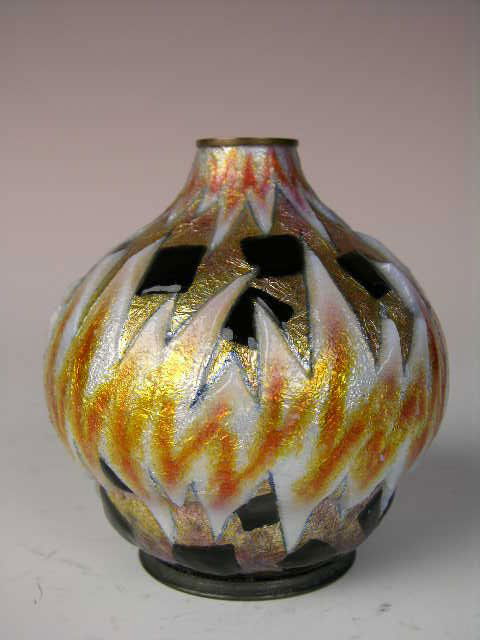 CAMILLE FAURE (CAMILLE FAURE:FRENCH 1874-1956) ENA: CAMILLE FAURE (CAMILLE FAURE:FRENCH 1874-1956).A VERY LARGE ENAMELED VASE IN A GEOMETRIC PATTERN IN GOLD, BLACK, GREY AND WHITE ENAMELS.SIGNED " C. FAURE LIMOGES FRANCE".HEIGHT 3 5/8".