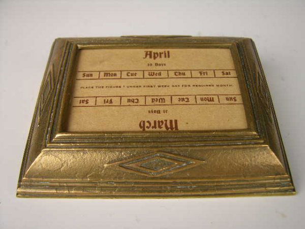TIFFANY STUDIOS "GRADUATE" DESK CALANDAR.: TIFFANY STUDIOS "GRADUATE" DESK CALANDAR WITH INSERT SHEETS.PROPERLY STAMPED TIFFANY STUDIOS NEW YORK 1792".LENGTH 4 1/4".(NO GLASS INCLUDED).