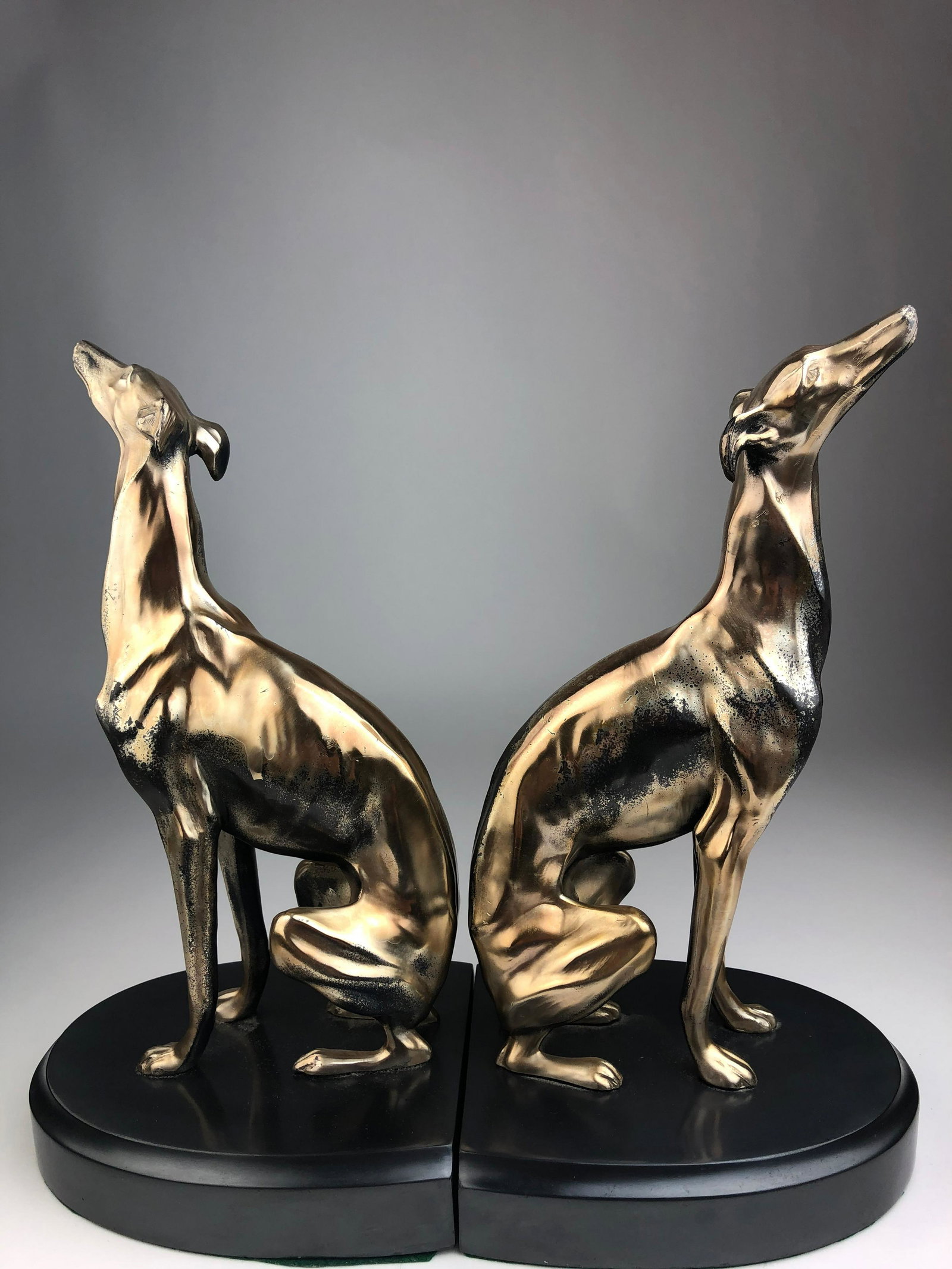Pair of Greyhounds metaPair of Greyhounds metal: Pair of Greyhounds metal bookends. Height 10 1/2 inches.