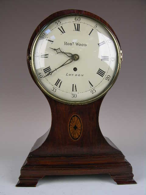 BALLOON MANTLE CLOCK CIRCA 1890. "ROBERT WOOD/LONDO: BALLOON MANTLE CLOCK CIRCA 1890. "ROBERT WOOD/LONDON. COMES WITH PENDULUM AND KEY, TIMEPIECE DOES NOT STRIKE. SINGLE FUSEE. CIRCA 1890. DIAL 8" DIAMETER. OVERALL HEIGHT 16 1/2". GOOD WORKING ORDER.