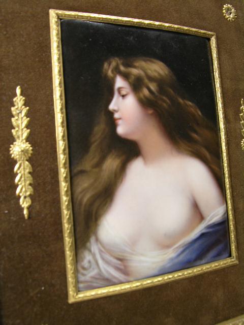 WAGNER KPM PLAQUE (KONIGLICHE PORZELLAN MANUFACTUR: WAGNER KPM PLAQUE (KONIGLICHE PORZELLAN MANUFACTUR:BERLIN GERMANY). PAINTED AFTER ASTI, DEPICTING A BARE BUST OF A BEAUTIFUL AUBURN HAIRED LADY DRAPED IN BLUE. PLAQUE MEASURES 4" X 5 3/4 " IN AN ORNAT