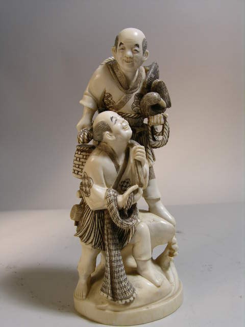 IVORY CARVING OF TWO MEN, ONE WITH A DUCK AND THE: IVORY CARVING OF TWO MEN, ONE WITH A DUCK AND THE OTHER WITH A ROPE. SIGNED ON THE BASE. HEIGHT 7" HIGH.INTERNATIONAL SHIPPING IS NOT AVAILABLE FOR THIS ITEM. THIS ITEM WILL ONLY SHIP WITHIN THE UNITE