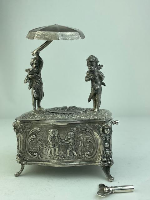 Mechanical singing bird box automaton with a young boy and girl with an umbrella (1 of 9)