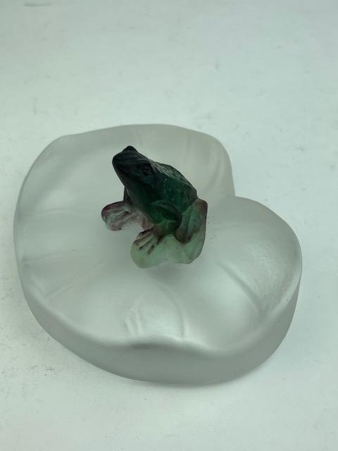 Daum France glass frog paper weight.: Daum France glass frog paper weight with a small froog sitting on a lily pad.Signed on the side "Daum France.Height 2 inches.