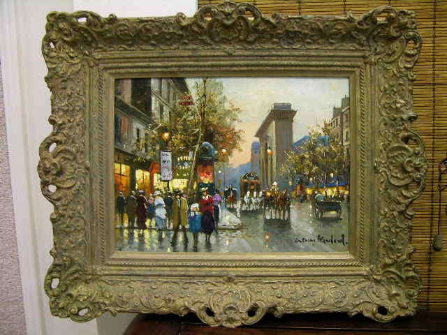 ANTOINE BLANCHARD, OIL ON CANVAS.: ANTOINE BLANCHARD (FRENCH:1910-1988) OIL ON CANVAS. A VERY WELL DONE PARIS STREET SCENE OF DRAWN HORSE CARTS GOING DOWN A STREET FILLED WITH WALKING PEOPLE WITH LIT STREET LLIGHTS AND SHOP WINDOWS. SI