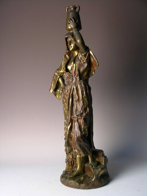 G. LEROUX FRENCH BRONZE "REBECCA".: A FINE FRENCH BRONZE OF "REBECCA" SIGNED "G. LEROX" (GASTON VUVENOT LEROUX:FRENCH, 1854-1942) IN THE BRONZE. THE BAREFOOTED REBECCA IS GATHERING WATER IN A LARGE VESSEL SHE IS HOLDING WITH HER HANDS A