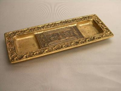 TIFFANY STUDIOS PEN TRAY IN THE "VENETIAN" PATTERN: TIFFANY STUDIOS PEN TRAY IN THE "VENETIAN" PATTERN. GOLD DORE FINISH. STAMPED "TIFFANY STUDIOS NEW YORK 1642". LENGTH 10". WIDTH 3 3/4". CIRCA 1920.
