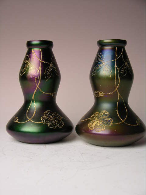 A PAIR OF ENAMELLED VASES.: A PAIR OF VICTORIAN ERA ENAMELLED VASES ATTRIBUTED TO THOMAS WEBB OF STOURBRIDGE;ENGLISH.DECORATED WITH GOLD ENAMELLED FLOWERS WITH LARGE LEAVES.HEIGHT 7 1/2".