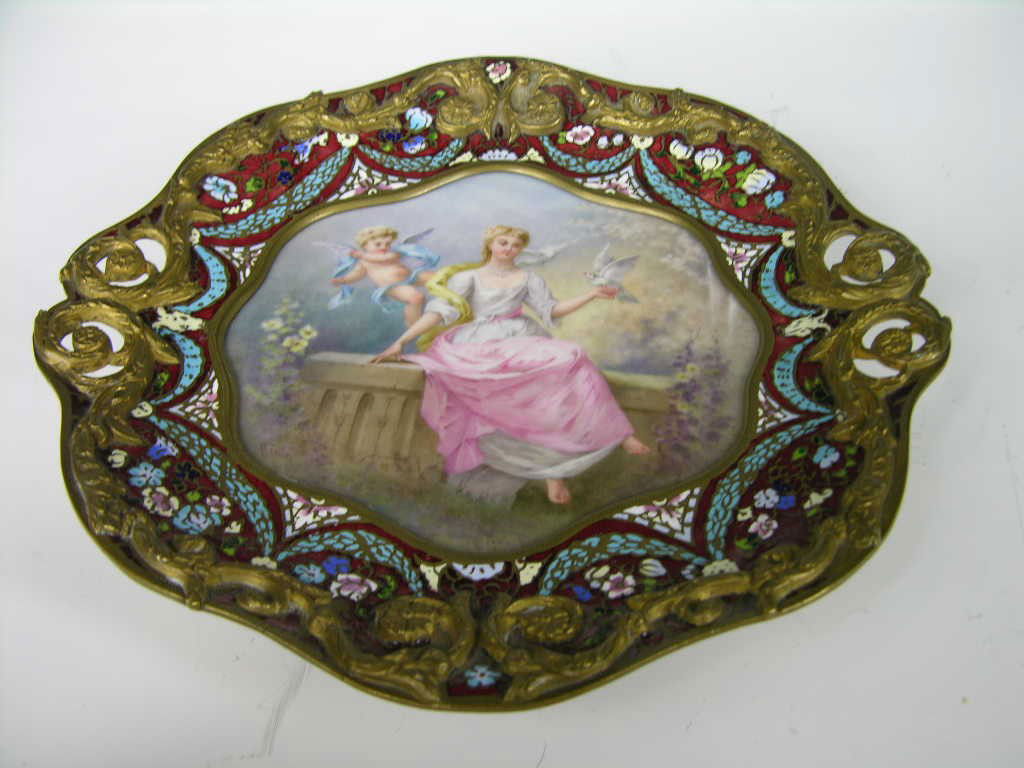 CHAMPLEVE ENAMELED TRAY WITH AN ONYX BASE.: CIRCA 1800 CHAMPLEVE ENAMELED AND SEVRES PAINTED DRESSER TRAY MOUNTED ON FOUR FEET. THE PAINTED TRAY IS BEAUTIFUL SCENE OF A MOTHER AND A WINGED CHILD, THE MOTHER IS SITTING ON A WALL AND SHE IS HOLDI