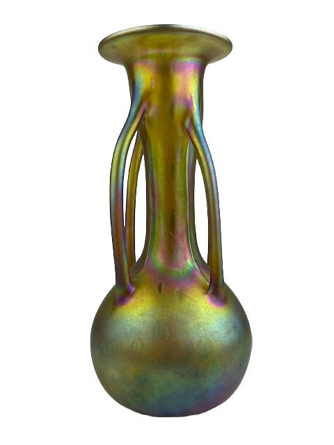 Loetz iridescent gold glass vase with a bulbous body, flared lip, and four buttr: Loetz iridescent gold glass vase with a bulbous body, flared lip, and four buttresses on the side, engrave "Muller" signature on the bottom.Circa 1920.Height 9 3/4 inches. Diameter 4 1/2 inches. Top d
