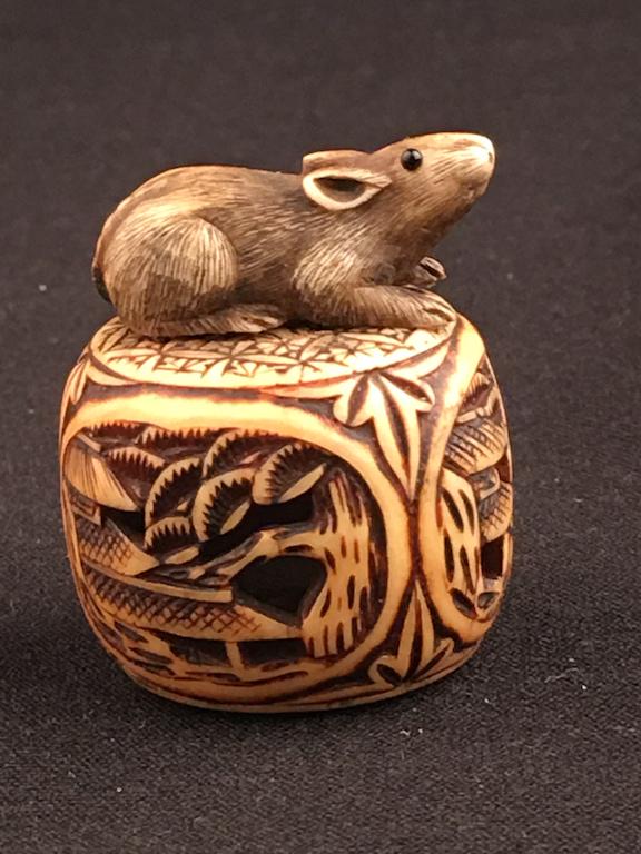 Antique carved Netsuke figure of a rat on the top of a basket. (1 of 5)