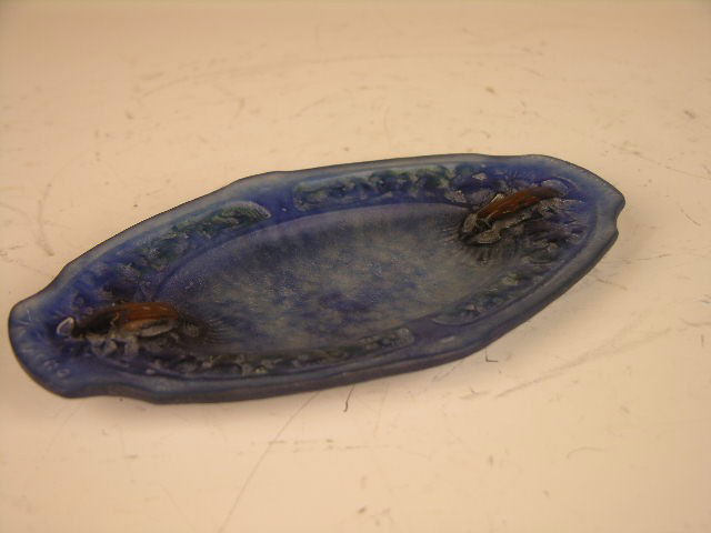 ALMERIC WALTER PATE DE VERRE DISH.: AN ALMERIC WALTER NANCY PATE DE VERRE DISH WITH TWO SMALL SCARABS AT EITHER END. IMPRESSED "A. WALTER NANCY"LENGTH 6 1/2".THE PATE DE VERRE TECHNIQUE TRANSLATES IN ENGLISH AS "PASTE OF GLASS." ESSENTI