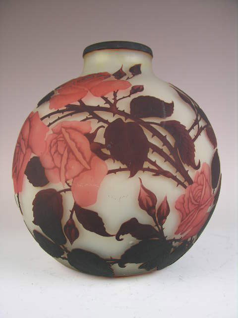 MULLER FRES VASE. A LARGE CAMEO VASE SIGNED "MUL: FINE MULLER FRES VASE. A LARGE CAMEO VASE SIGNED "MULLER FRES LUNEVILLE". DECORATED WITH RED ROSES, LEAVES AND TWIGS. HEIGHT 11 5/8" X 11" AT WIDEST POINT WITH A 3 3/4" OPENING DIAMETER. CIRCA 1910.