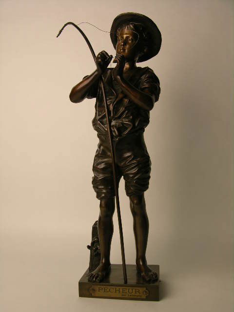 ADOLPHE JEAN LAVERGNE BRONZE FISHERMAN.: ADOLPHE JEAN LAVERGNE (FRENCH: 1852-1901).A VERY NICE AND WELL DONE BRONZE FISHERMAN BAITING HIS HOOK IN A RICH BROWN PATINA.SIGNED "LAVERGNE" IN THE BRONZE.THE FRONT PLAQUE READS "PECHEUR PAR LAVERGN