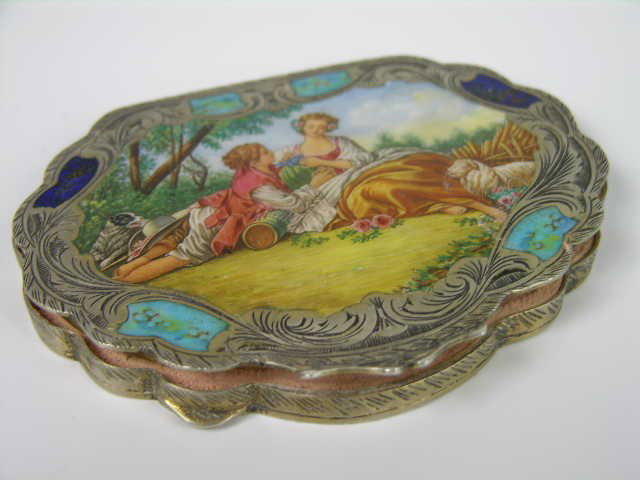 ANTIQUE STERLING SILVER ENAMELED COMPACT.: ANTIQUE STERLING SILVER ENAMELED COMPACT, THE LID IS DECORATED WITH EIGHT WOMEN IN A LANDSCAPE BACKGROUND AND A FOLIATED DESIGN ON THE SIDES AND BOTTOM OF THE COMPACT. THE INSIDE MIRROR IS CRACKED BUT