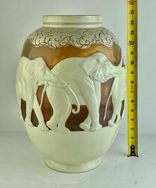 Galle cameo vase. Very rare and hard to fine Galle "Elephant" cameo vase: Galle cameo vase. Very rare and hard to fine Galle "Elephant" cameo vase decorated with herd of 6 white elephants all around the base and a ring of clouds to the the top. One central palm tree the alm