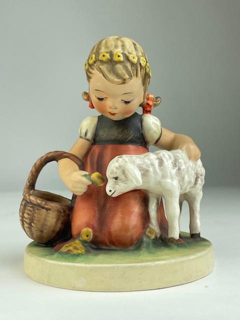 Goebel Hummel figurine 361 "Favorite Pet". A young girl with a basket feeding a: Goebel Hummel figurine 361 "Favorite Pet". A young girl with a basket feeding a lamb. Circa 1960.Properly marked.Height 4 1/2 inches.