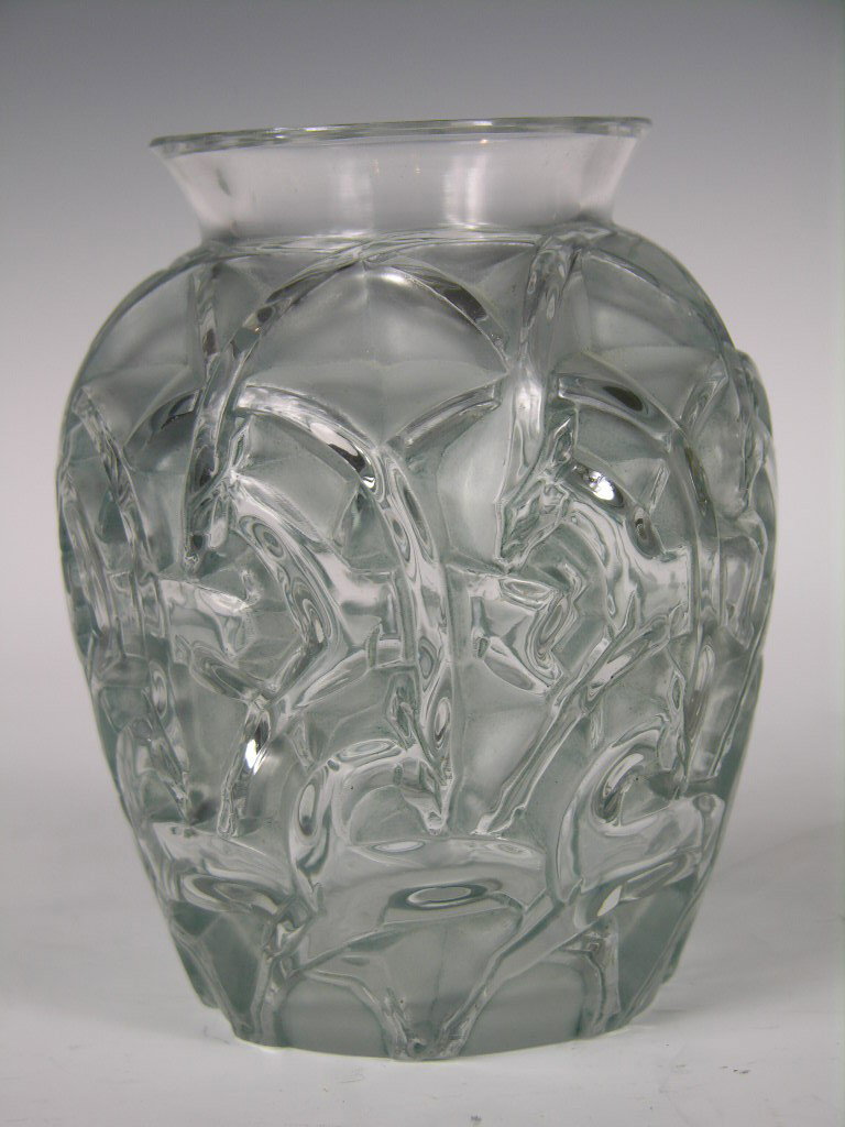 A very rare Rene Lalique (French:1860-1945) "Chamo: A very rare Rene Lalique (French:1860-1945) "Chamois" vase in frosty glass. Several rows of running long horned antelope all around in very high detail. Acid etched "R. Lalique France. Height 4 7/8". 