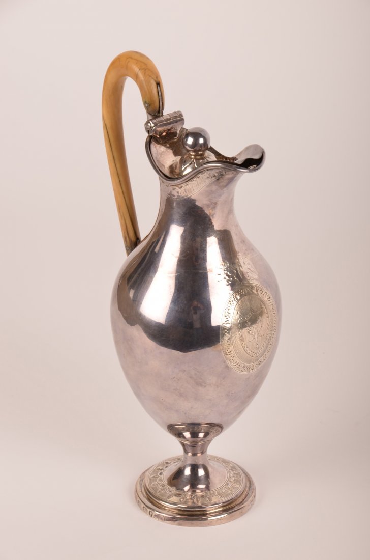 Hester Bateman George III sterling silver teapot: Hester Bateman (1708-1794) George III sterling silver baluster-form teapot with engraved Heraldic Crest and ivory handle, 1788. H: 9 3/8"