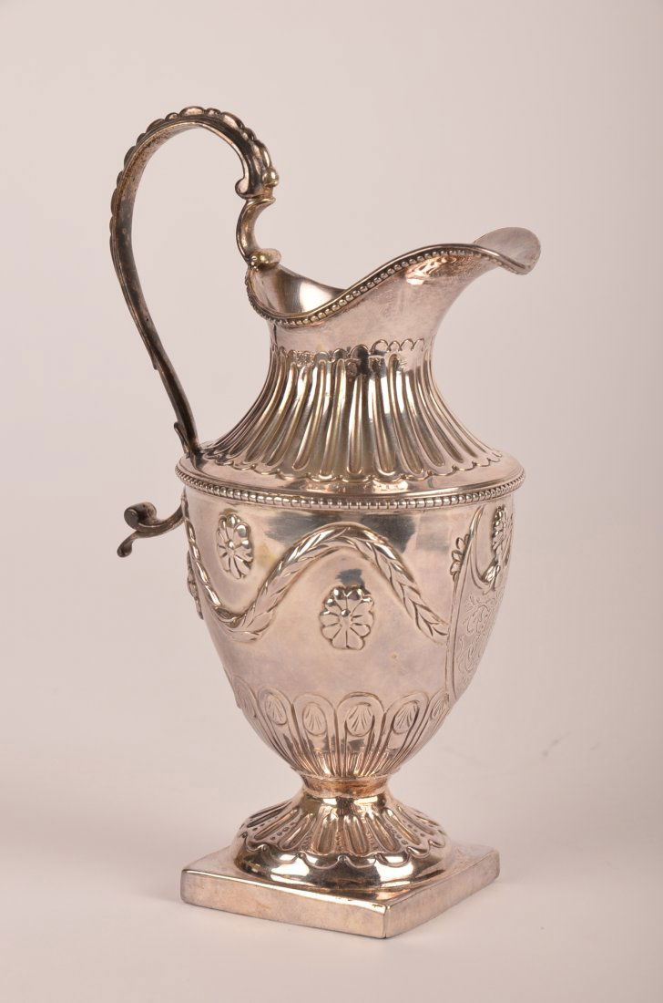 Hester Bateman George III Sterling Silver Creamer: Hester Bateman (1708-1794) George III Sterling Silver Creamer, repousse, 1776. Height: 6 3/8"