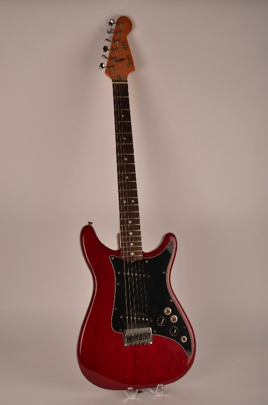 Fender Lead II Guitar, serial number E013528 (1980: Fender Lead II Guitar, serial number E013528 (1980) with the original Fender molded plastic hard shell case. This is the same model and color Eric Clapton played. Note: Hard Rock Memorabilia: Eric Cla