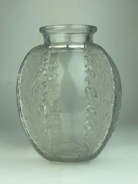 Rene Lalique "Chandons" crystal vase.: Rene Lalique "Chandons" crystal vase. In clear and frosty glass decorated with thisles at each corner. Molded "R. Lalique" on the bottom. Height 7 1/8 inches.