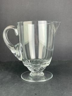 Lalique France "Barsac" crystal 40 oz water pitcher with attached handle.: Lalique France "Barsac" crystal 40 oz water pitcher with attached handle. Bottom with a swirl effect. Signed "Lalique France" in script on the bottom. Height 7 1/2 inches. Diameter 5 1/8 inches.