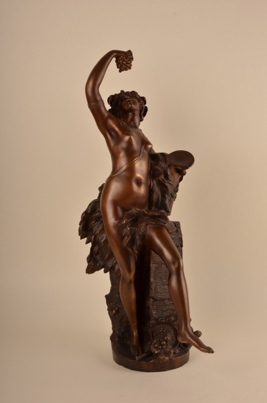 Auguste Moreau bronze figure.: Auguste Moreau (French:1834-1917). A bronze figure of a semi-lady holding a cluster of grapes in her right hand and a cup in her left hand.Signed Moreau as well as 1780.
